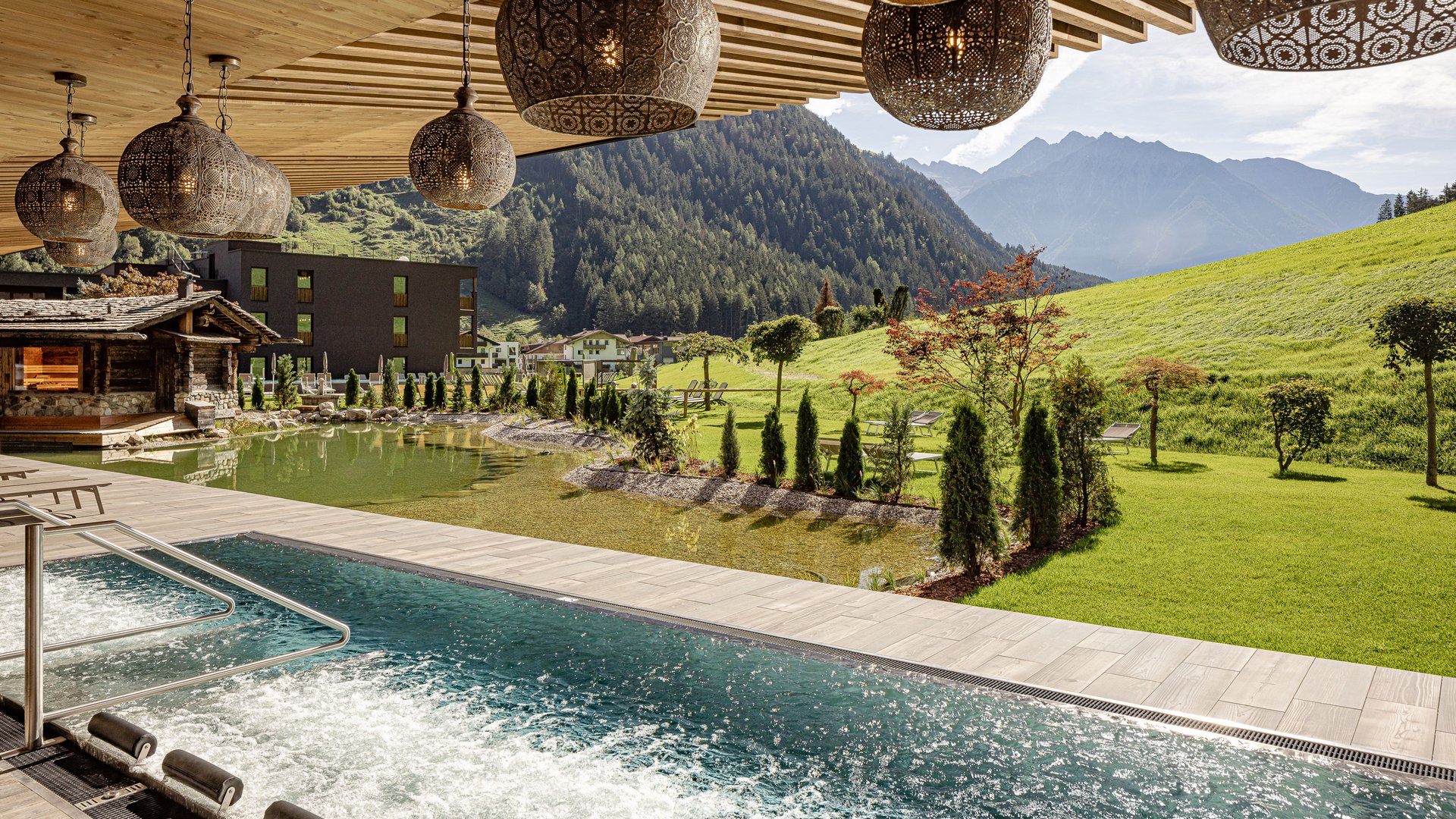 Relaxation at the natural bathing pond Luxury hotel holidays in Italy - SCHWARZENSTEIN, spa in the Dolomites